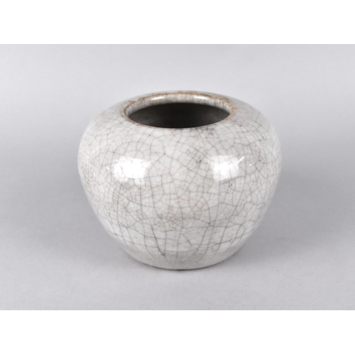 284 - A Chinese Monochrome Crackle Glazed Pot of Squat Form, 7cm high