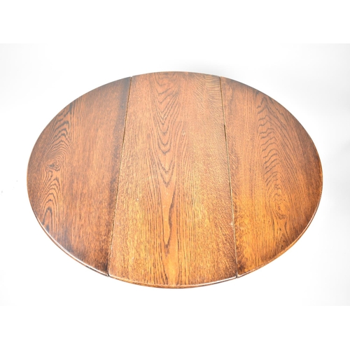 183 - A Small Mid 20th Century Oak Oval Topped Drop Leaf Occasional Table, 56cms Long