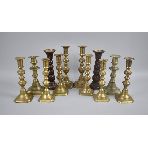 197 - A Collection of Various Brass and Wooden Candlesticks