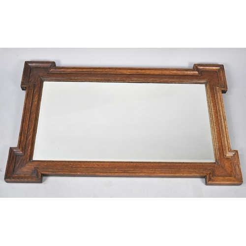 233 - An Edwardian Oak Framed Rectangular Wall Mirror, 94cms by 59cms