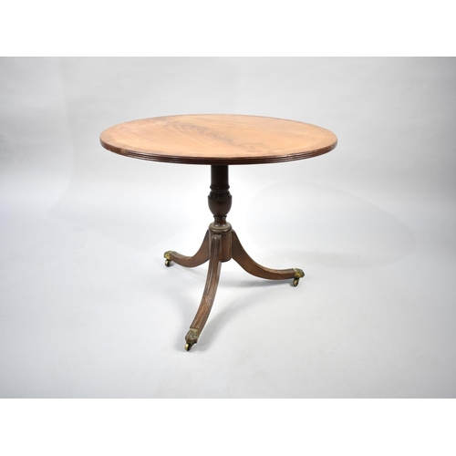 273 - A Reproduction Mahogany Snap Top Tripod Table with Cross Banded Top, 64cm diameter