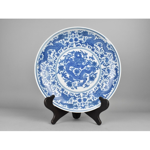 292 - A Chinese Porcelain Blue and White Charger with Dragon Decoration, 31cm Diameter, Seal Mark to Base,... 