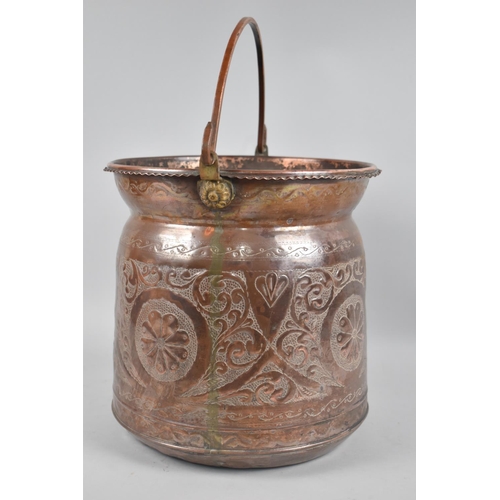 376 - A Kurdish/Turkish Copper Bucket with Repousse Work Decoration and Loop Carry Handle, 26cm diameter a... 