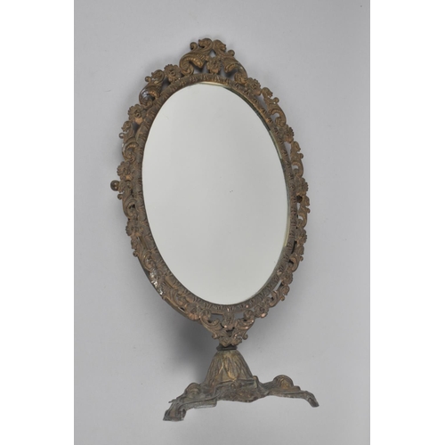 380 - A Mid 20th Century Brass Oval Dressing Table Mirror on Triform Base, 38cm high