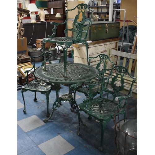 467 - A Green Painted Cast Metal Four Piece Garden Patio Set to Comprise Circular Table and Four Chairs