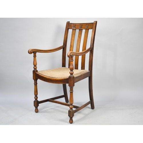 539 - An Edwardian Oak Armchair with Carved Top Rail