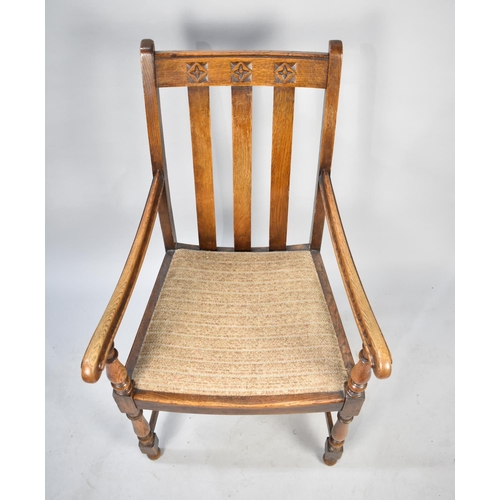 539 - An Edwardian Oak Armchair with Carved Top Rail