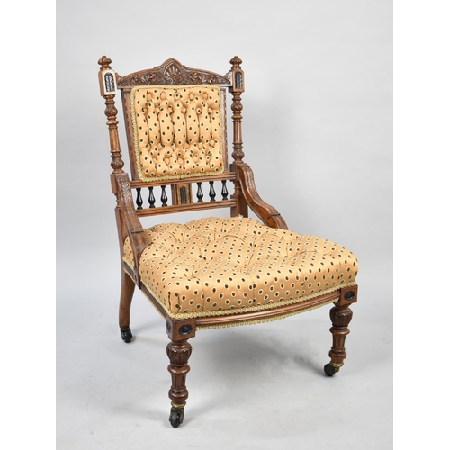 543 - A Pretty Carved Late Victorian or Edwardian Nursing Chair with Button Upholstery