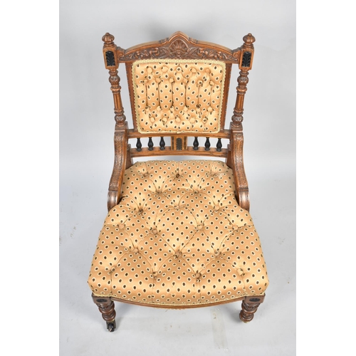 543 - A Pretty Carved Late Victorian or Edwardian Nursing Chair with Button Upholstery