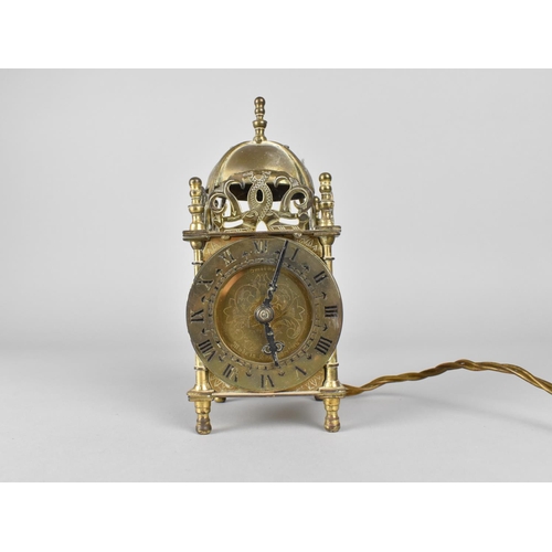 68 - A Reproduction Brass Lantern Clock with electric Movement, 18cms High