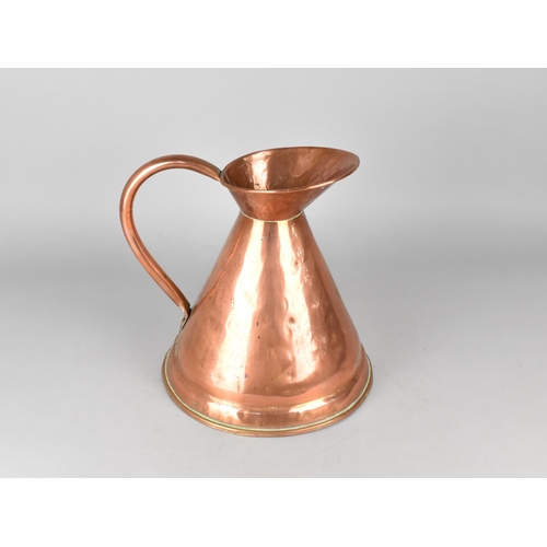 77 - A Reproduction Copper Measuring Jug, 28cms High