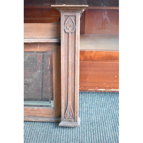 262 - An Arts and Crafts Oak Over Mantle Mirror, 176cm wide