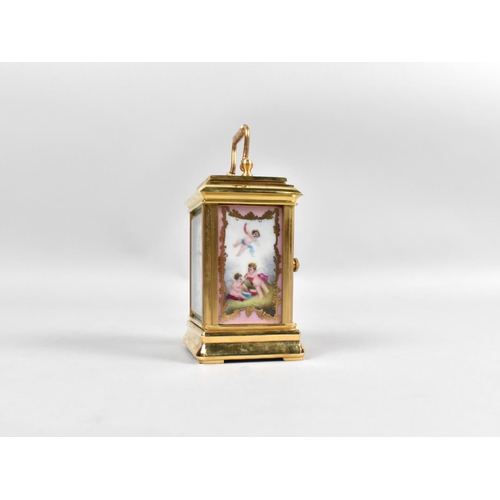 12 - A Miniature Sevres Style Gilt Brass Carriage Clock with Subsidiary Dials for Day and Date, Porcelain... 