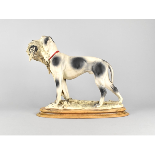 182 - A Large Resin Study of Sporting Dog Carrying Cock Pheasant on Oval Plinth Base, 38cms Wide