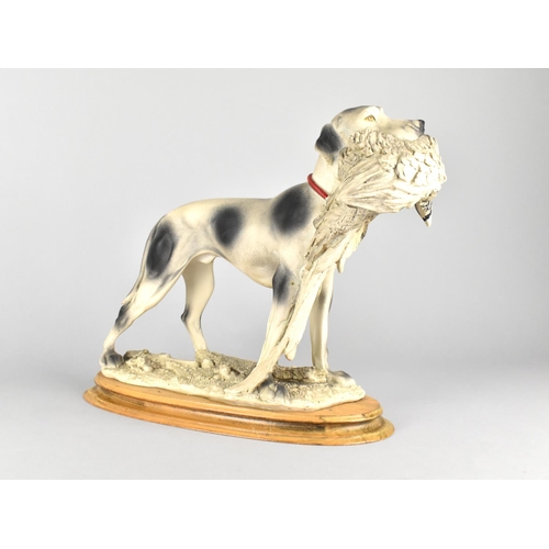 182 - A Large Resin Study of Sporting Dog Carrying Cock Pheasant on Oval Plinth Base, 38cms Wide