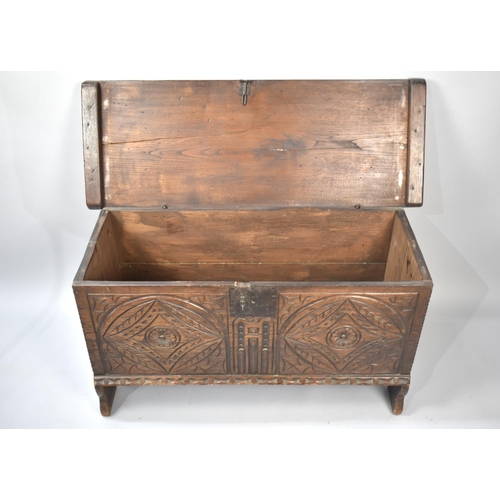 252 - An Oak Sword Chest with Hinged Lid and Carved Front Panel, 102cms Wide