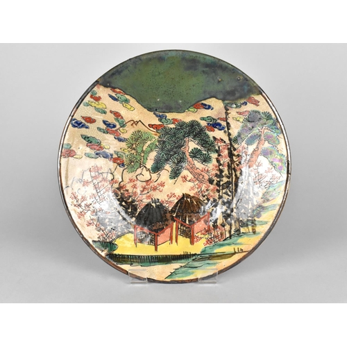 306 - An Oriental Crackle Glazed Dish Decorated in Polychrome with Village Scene Decoration and Oxidised T... 