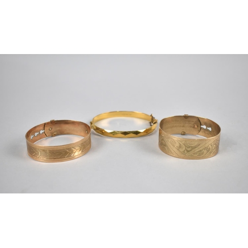 439 - A Collection of Three Gold Plated Bangles to include Two Early/Mid 20th Century Fidelity Examples in... 