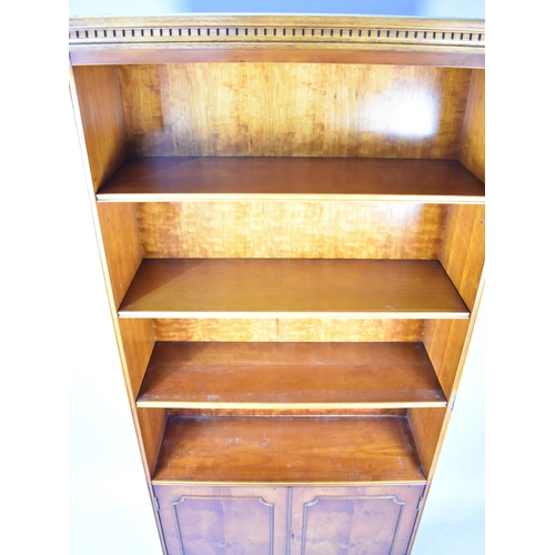 531 - A Modern Yew Wood Library Bookcase with Three Adjustable Shelves and Base Cupboard, Dentil Cornice, ... 