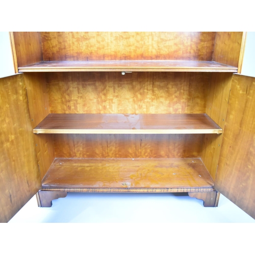 531 - A Modern Yew Wood Library Bookcase with Three Adjustable Shelves and Base Cupboard, Dentil Cornice, ... 