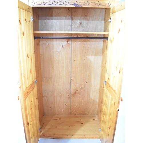 545 - A Modern Pine Double Wardrobe with Carved Rail, 107cm wide