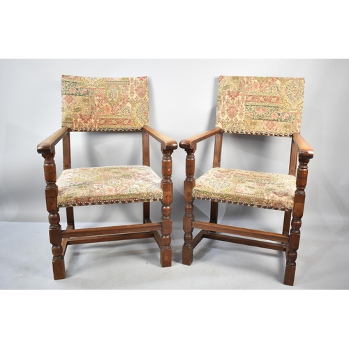 561 - A Pair of Tapestry Upholstered Oak Framed Scroll Armchairs with Brass Studding