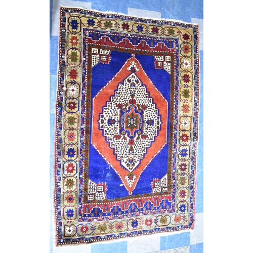 562 - A Patterned Rug on Blue Ground, 185x124cm