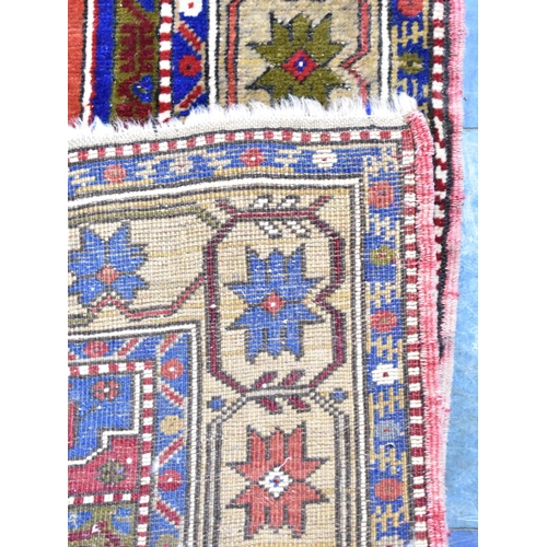 562 - A Patterned Rug on Blue Ground, 185x124cm