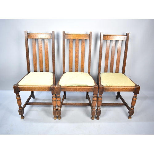 566 - A Set of Three Edwardian Oak Dining Chairs