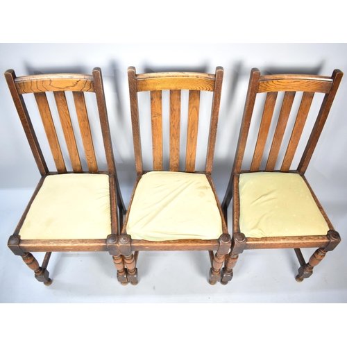 566 - A Set of Three Edwardian Oak Dining Chairs