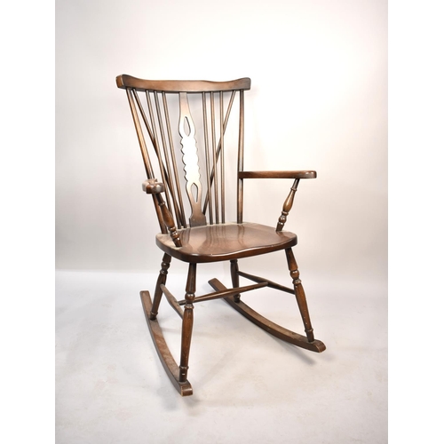 569 - A Mid 20th Century Oak Rocking Chair with Pierced Splat