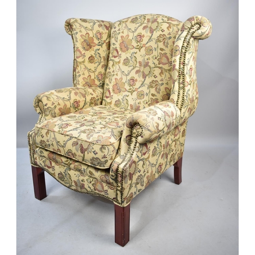 571 - A Tapestry Upholstered Wing Armchair