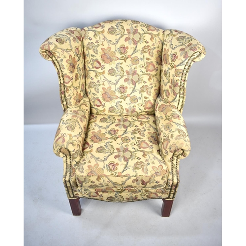 571 - A Tapestry Upholstered Wing Armchair