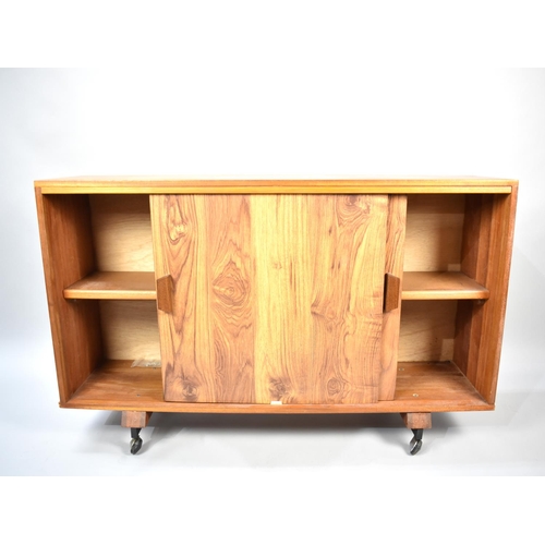 575 - A 1970's Side Cabinet on Casters with Sliding Doors, 120cm wide