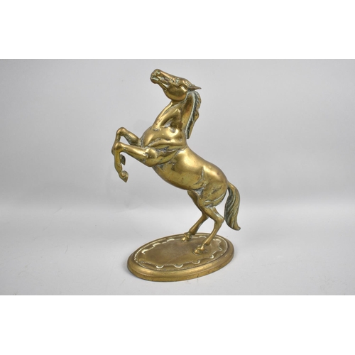 66 - A Modern Cast Brass Model of a Rearing Stallion, 26cms High