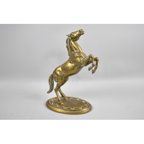 66 - A Modern Cast Brass Model of a Rearing Stallion, 26cms High