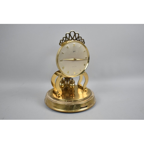 67 - A Mid 20th Century Pedestal Brass Mantel Clock by Schatz and Sons, Under Plastic Dome, 22.5cms High