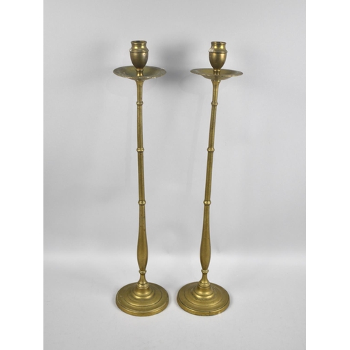 76 - A Pair of Tall Slender Brass Candlesticks, 55cms High