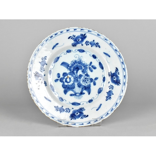 397 - An 18th Century Delft Tin Glazed Plate with Floral Motif, 23cm Diameter