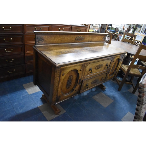 518 - An Oak Galleried Sideboard with Two Centre Drawers Flanked by Cupboards, 151cm