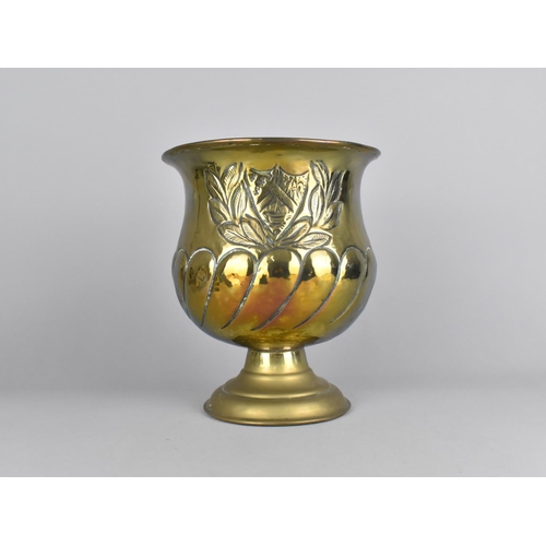 125 - A Brass Vase with Heraldic and Laurel Leaf Decoration in Relief, 19.5cms Diameter and 23cms High