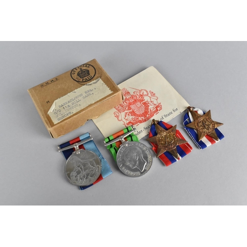 143 - An Original Cardboard Box Containing Four WWII Medals Awarded to P Barraclough