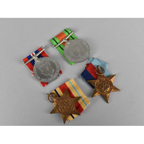 146 - A Collection of Four WWII Medals to Comprise Defence Medal, 1939-45 Medal, 39-45 Star and Africa Sta... 