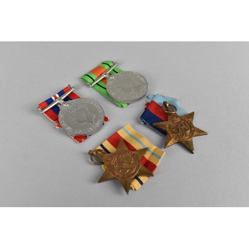 146 - A Collection of Four WWII Medals to Comprise Defence Medal, 1939-45 Medal, 39-45 Star and Africa Sta... 