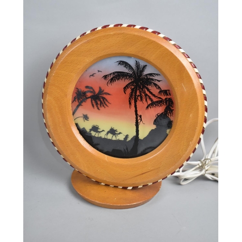 162 - A 1950s Back Lit Table Lamp decorated with Arabic Scene and Monkey Climbing Palm Tree, 25cms High