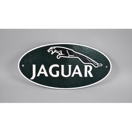 193 - A Reproduction Cast Metal Cold Painted Oval Sign for Jaguar, 35cms Long