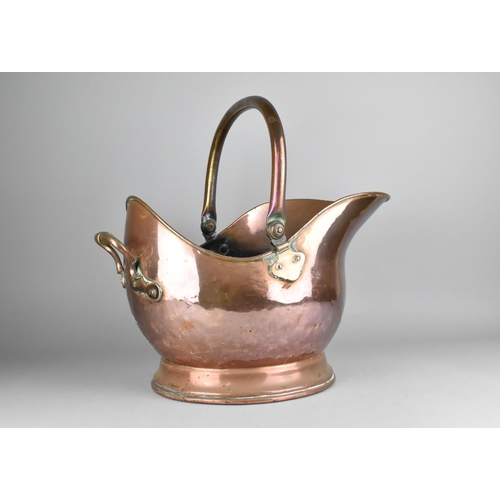 198 - A Vintage Copper Helmet Shaped Coal Scuttle, 43cms Long