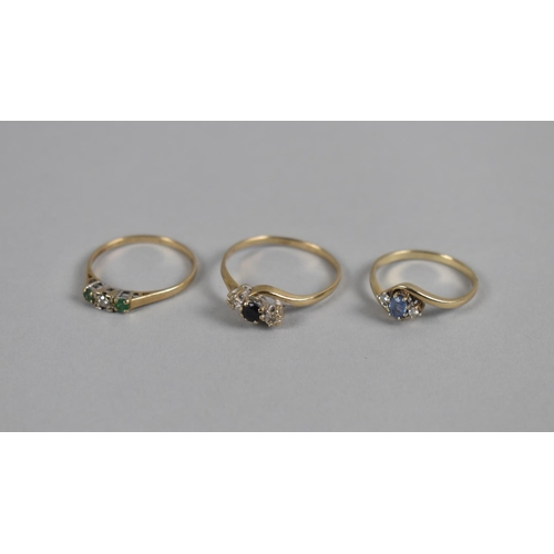 427 - A Collection of Three Diamond and Precious Stone Trilogy Rings to comprise Emerald, Sapphire and Aqu... 