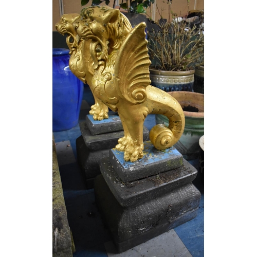 451 - A Large Pair of Painted Reconstituted Studies of Winged Griffin on Tapering Plinth Bases, 84cm high