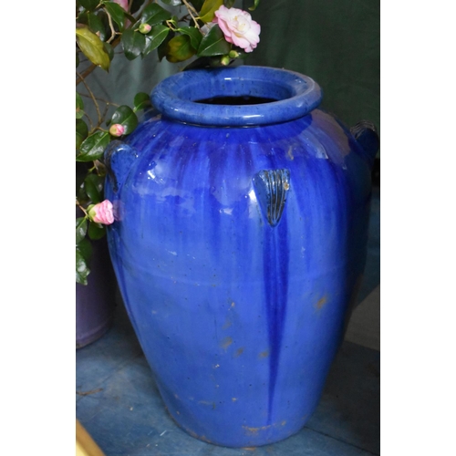 460 - A Blue Glazed Garden Water Jar with Lug Handles, 63cm high